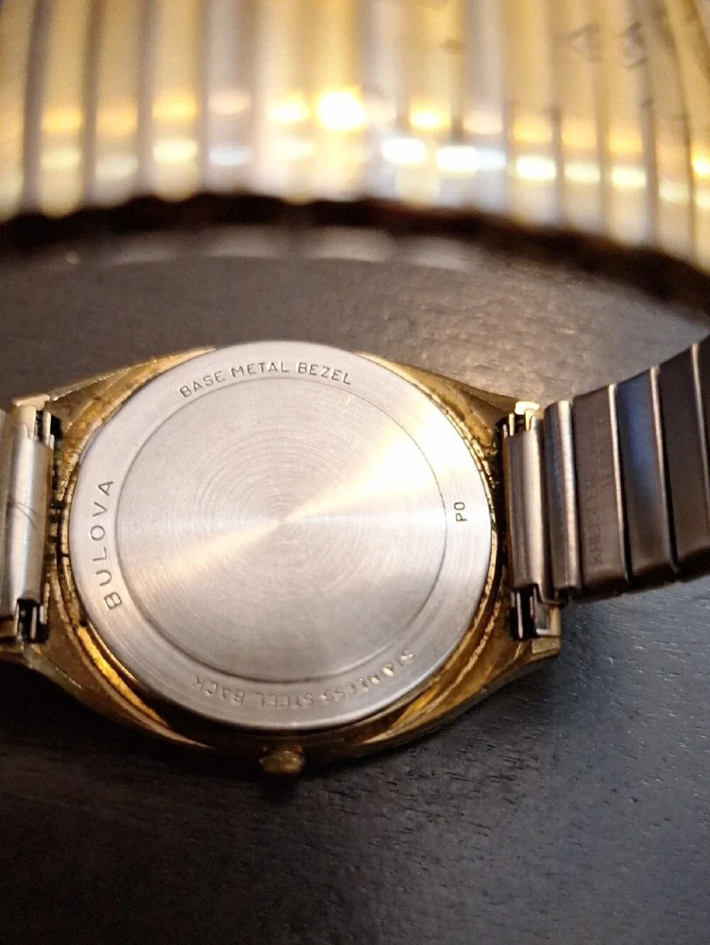 Bulova Gold and White Dress Watch with Roman Numerals‎